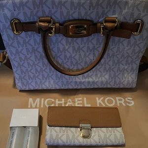 Brand new Michael purse with matching wallet and leather care kit